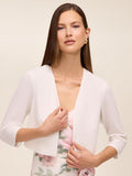 Knit crepe bolero with 3/4 sleeves and open-front design by Le Chateau.