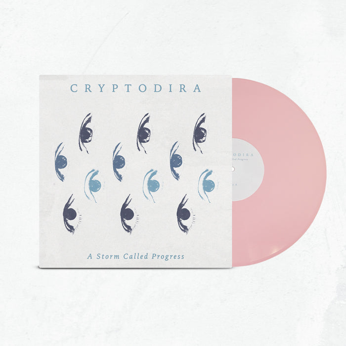 A limited edition light pink vinyl slides out of a cover featuring blue and black stylized eye art. The cover displays Cryptodira at the top and A Storm Called Progress at the bottom.