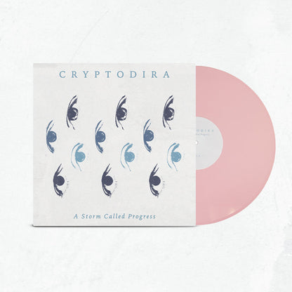 A limited edition light pink vinyl slides out of a cover featuring blue and black stylized eye art. The cover displays Cryptodira at the top and A Storm Called Progress at the bottom.