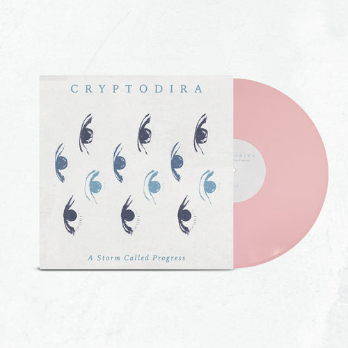 A limited edition light pink vinyl slides out of a cover featuring blue and black stylized eye art. The cover displays Cryptodira at the top and A Storm Called Progress at the bottom.