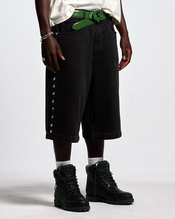 BADGES JORTS BLACK LICORICE - black baggy denim shorts, front view on male model - Cold Culture #man
