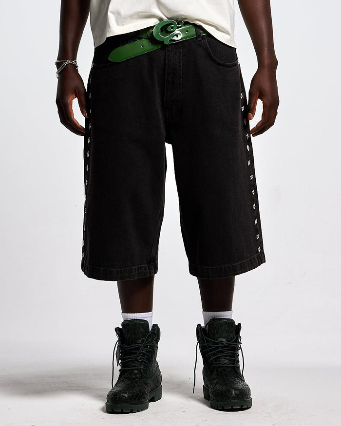 BADGES JORTS BLACK LICORICE - black baggy denim shorts, front view on male model - Cold Culture #man