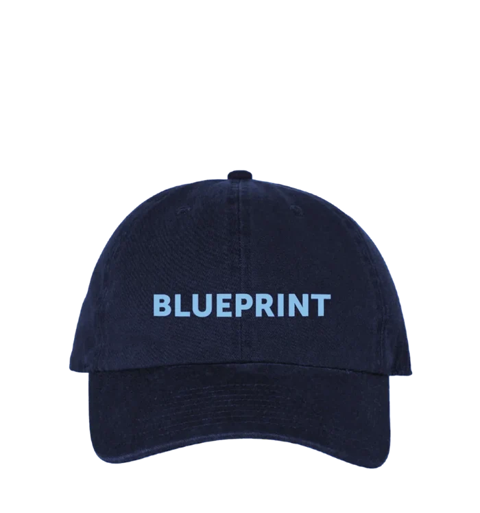 Navy blue cap with 'BLUEPRINT' text on a white background