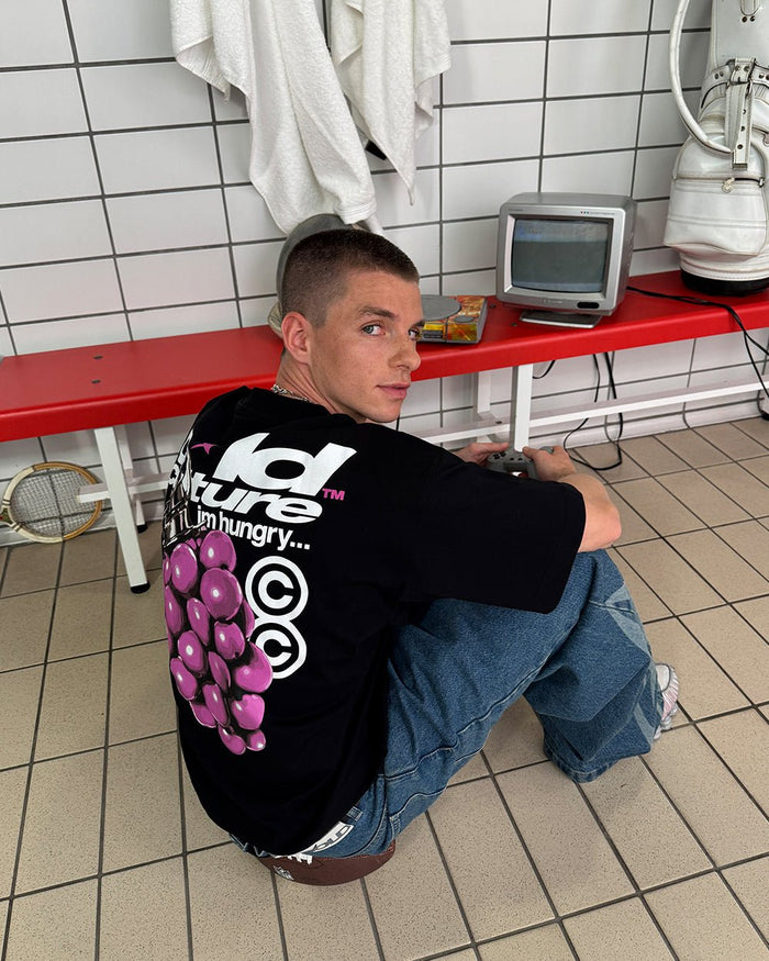 BOOM TEE BLACK - black graphic print tee, back view on male model - Cold Culture