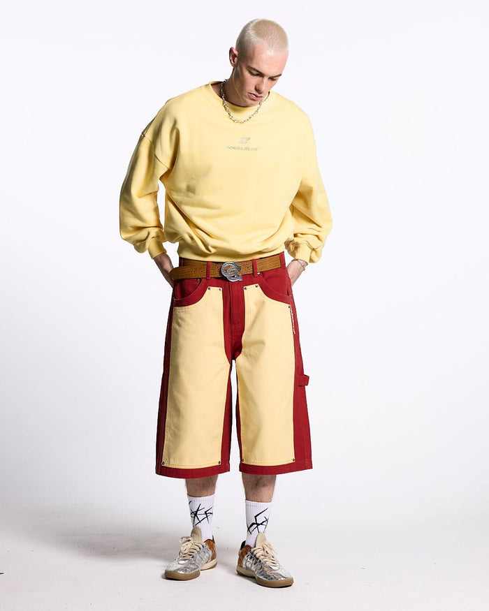 CARPENTER PANELS SHORTS BURGUNDY AND VANILLE - burgundy and cream carpenter shorts, front view on male model - Cold Culture #man