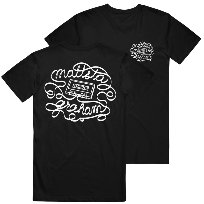 Black t-shirt made from soft U.S. cotton by Mattstagraham, featuring a white cassette tape graphic and the words "Mattsta Graham" in curly script on the back. The relaxed fit ensures everyday comfort, with a smaller matching design on the front left chest—evoking classic American Apparel style.