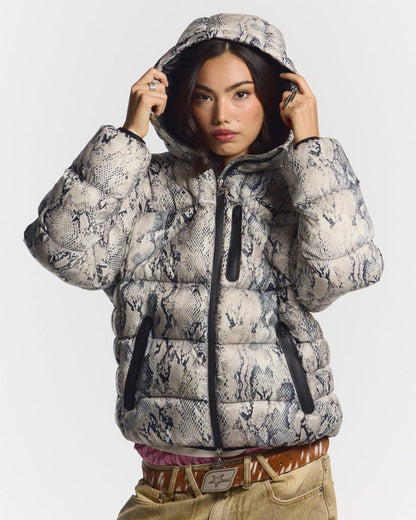 CLOUD ARMOR PUFFER SNAKE - snake print puffer jacket, front view on female model - Cold Culture #woman