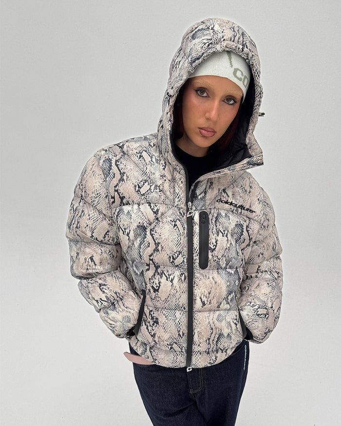 CLOUD ARMOR PUFFER SNAKE - snake print puffer jacket, front view on female model - Cold Culture