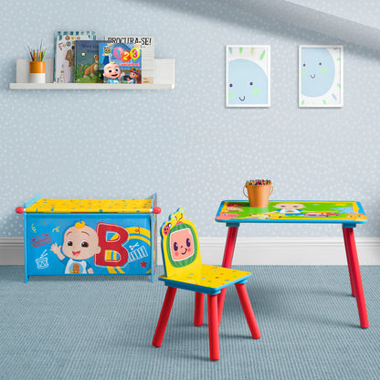 Children's table and chair set with colorful design in a room with blue walls and a shelf.