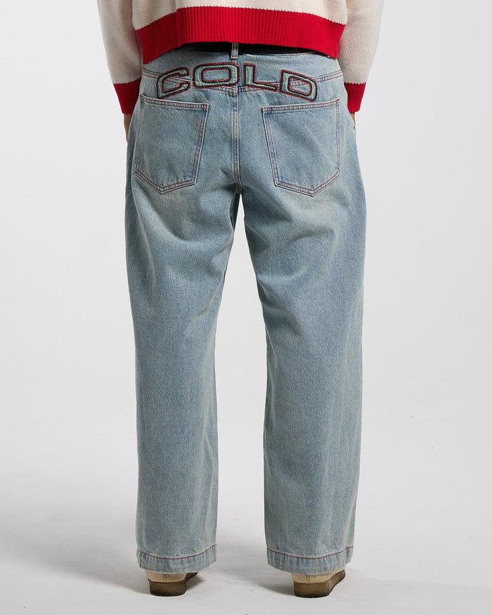 COWBOY V1 PANTS BLUE DENIM - light blue baggy denim pants, back view on male model - Cold Culture #man