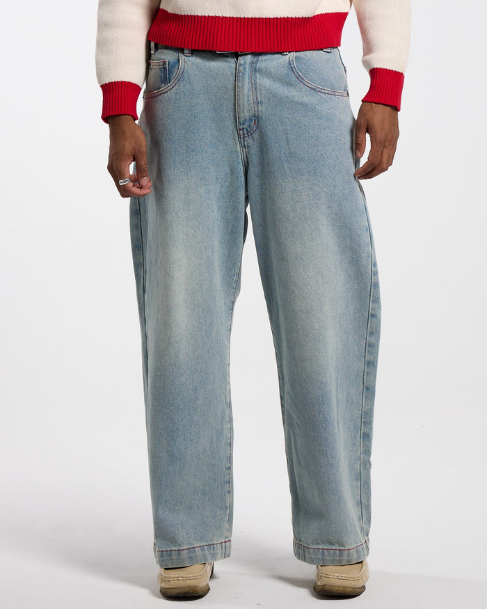 COWBOY V1 PANTS BLUE DENIM - light blue baggy denim pants, front view on male model - Cold Culture #man