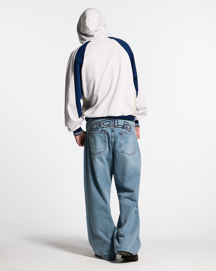 COWBOY V1 PANTS BLUE DENIM - light blue baggy denim pants, back view on male model - Cold Culture #man