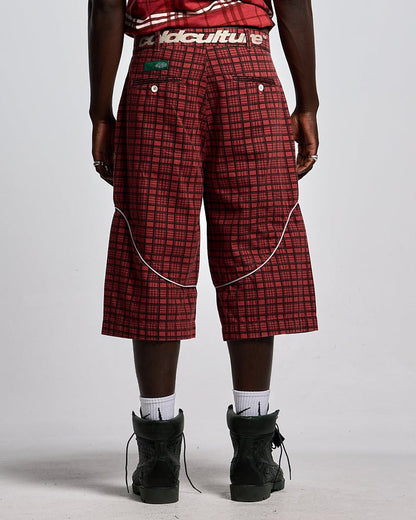 CRIMSON PLAID SUIT JORTS - red plaid shorts, back view on male model - Cold Culture #man