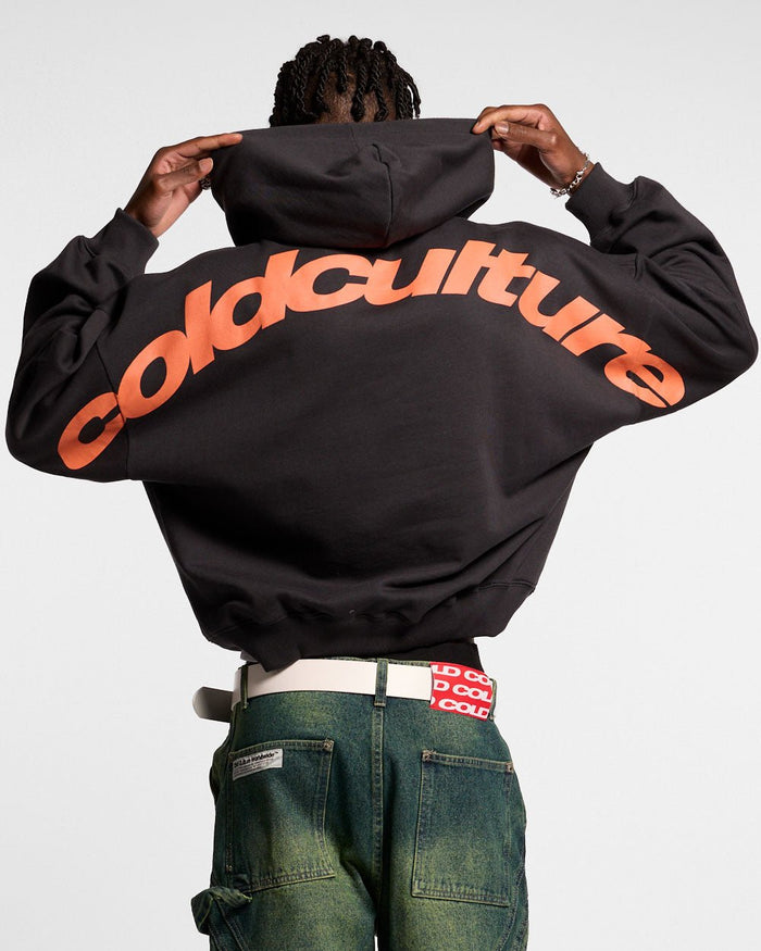 CURVED HOODIE BLACK - black logo print hoodie, back view on male model - Cold Culture #man