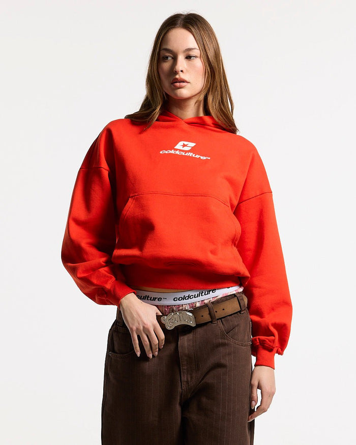 CURVED HOODIE VIBRANT RED - red logo print hoodie, front view on female model - Cold Culture