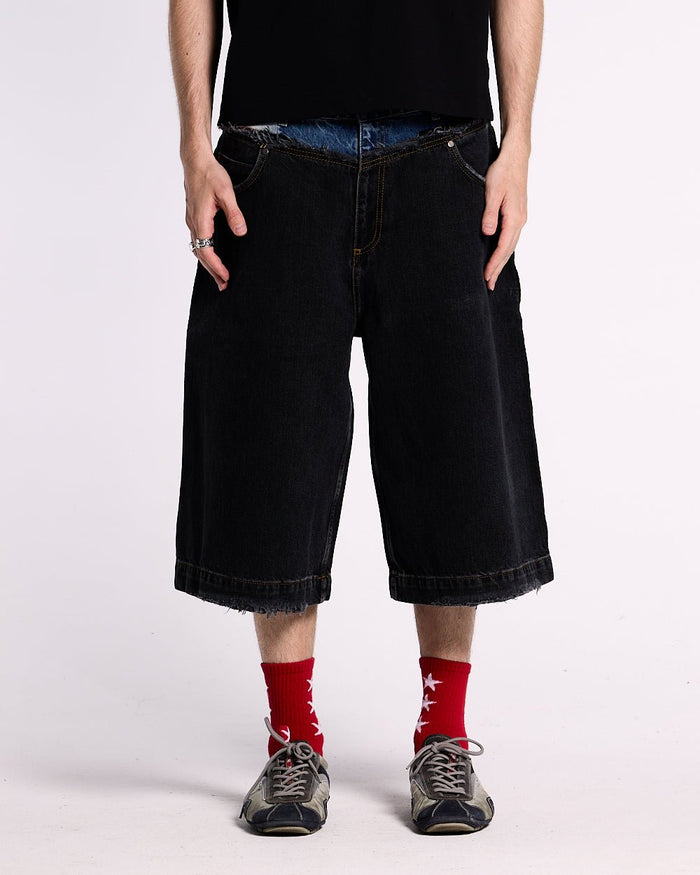 DARK SEA SHORT - baggy black denim shorts, front view on male model - Cold Culture #man