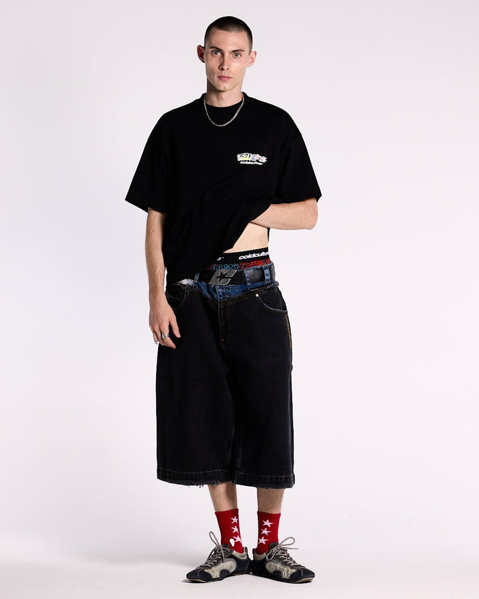 DARK SEA SHORT - baggy black denim shorts, front view on male model - Cold Culture #man
