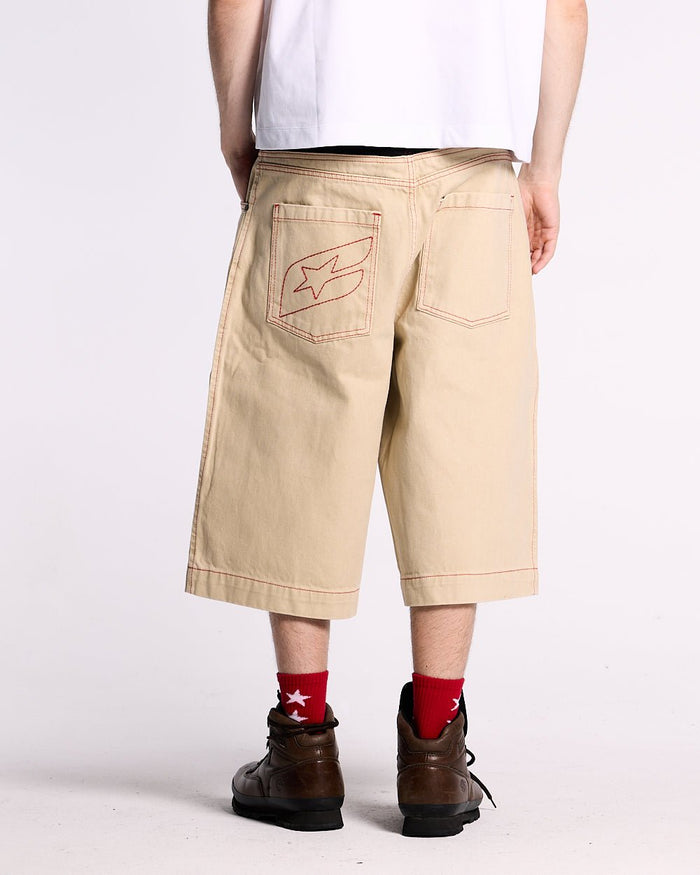 DESERT SHORT - baggy beige denim shorts, back view on male model - Cold Culture #man