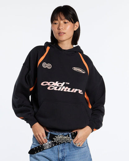 DETAILED HOODIE BLACK - black and orange hoodie, front view on female model - Cold Culture #woman
