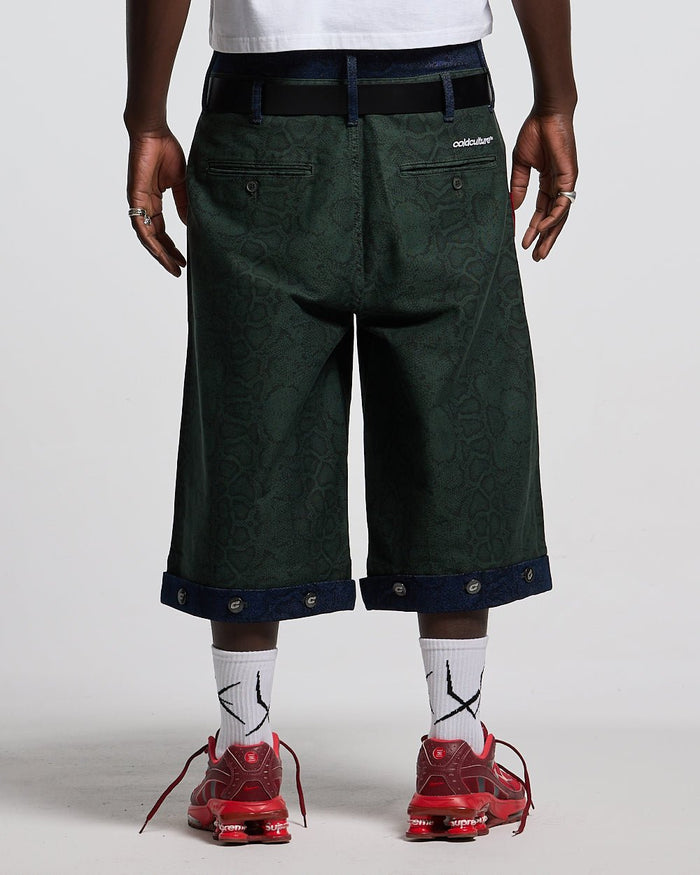 DOUBLE WAIST SNAKE SUIT JORTS GREEN - green snake print shorts, back view on male model - Cold Culture #man