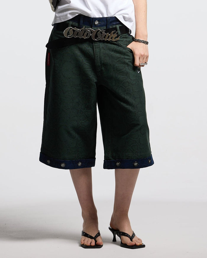 DOUBLE WAIST SNAKE SUIT JORTS GREEN - green snake print shorts, front view on female model - Cold Culture #woman