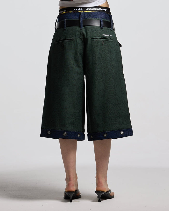 DOUBLE WAIST SNAKE SUIT JORTS GREEN - green snake print shorts, back view on female model - Cold Culture #woman