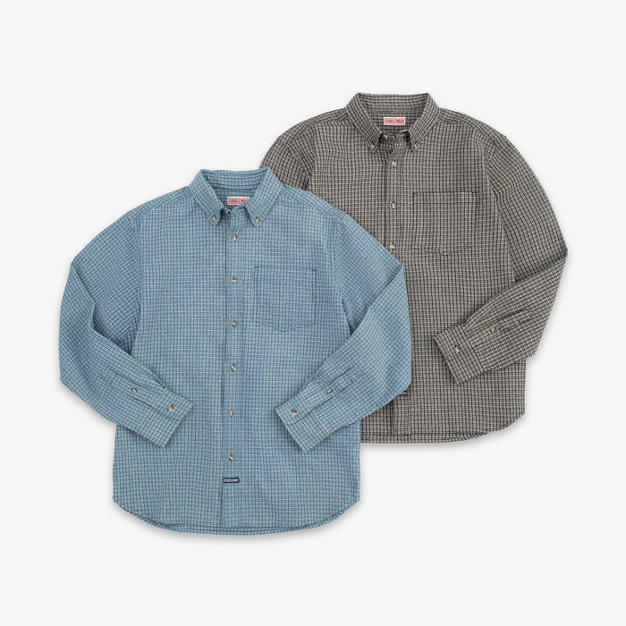 A light blue and white checkered long-sleeve button-down shirt with a chest pocket, displayed flat against a light gray background.