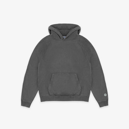 A dark gray washed cotton hoodie with a front kangaroo pocket and a small circular logo on the left sleeve cuff, displayed flat against a light gray background.