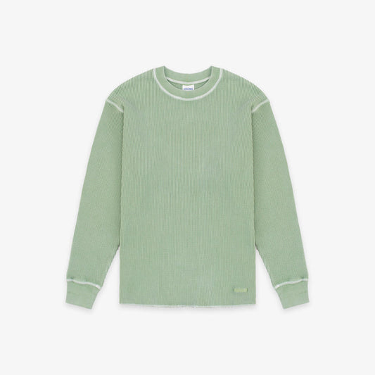 A sage green ribbed knit long-sleeve shirt with contrasting light green trim along the crew neck, shoulders, cuffs, and hem, displayed flat against a light gray background.