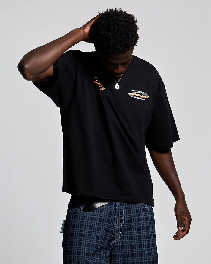 DYNAMIC TEE BLACK AND ORANGE - black graphic print tee, front view on male model - Cold Culture #man