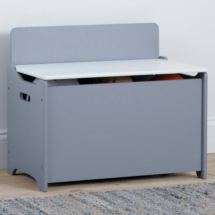 Gray toy storage bench with white top in a room setting