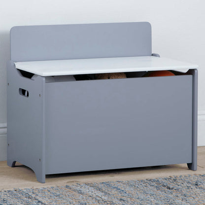 Gray toy storage bench with white top in a room setting