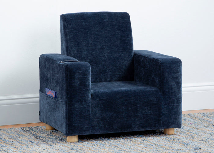 Blue armchair on a light gray rug with a white wall background