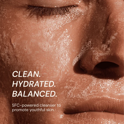 Close-up of a person's face with soap bubbles, text about cleanser benefits.