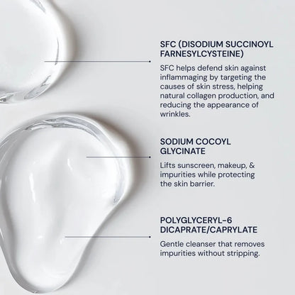 Clear liquid droplets with text about skincare ingredients on a light gray background