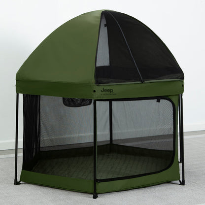 A green hexagon-shaped pop-up play yard with a removable canopy and mesh netting on the sides.