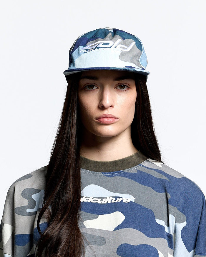 HOCKEY CAP BLUE CAMO - blue camo cap, front view on female model - Cold Culture #woman