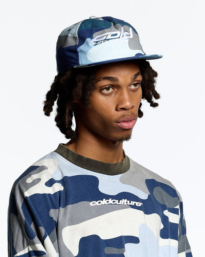 HOCKEY CAP BLUE CAMO - blue camo cap, front view on male model - Cold Culture #man