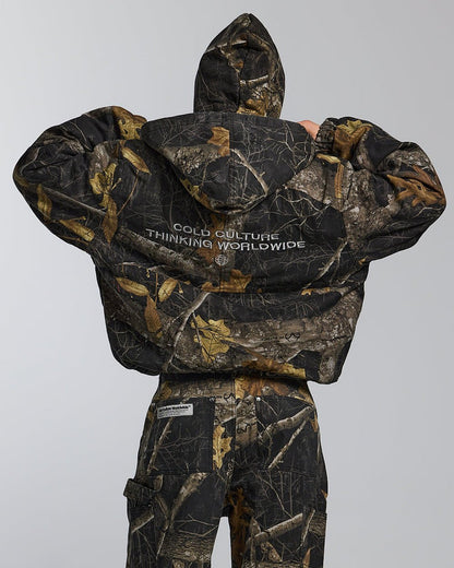 HOODED JACKET REALTREE BLACK - black realtree camo hooded jacket, back view on female model - Cold Culture #woman