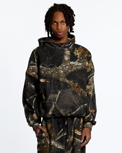 HOODIE REALTREE BLACK - black realtree camo hoodie, front view on male model - Cold Culture #man