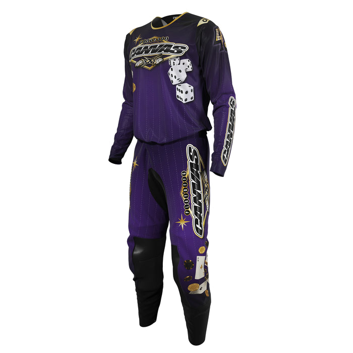 Purple and black motocross outfit with rolling dice and a Las Vegas styled logo for Canvas MX.