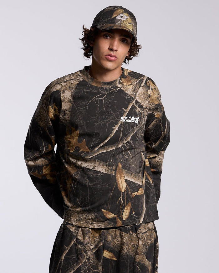 LONGSLEEVE REALTREE BLACK - black camo longsleeve tee, front view on male model - Cold Culture #man