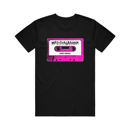 Relax in vintage style with this black Mattstagraham T-shirt, featuring a pink cassette tape graphic labeled "MATTSTAGRAHAM" and "LOST MEDIA" in bold white and black text. Crafted from 100% U.S. cotton, this classic American Apparel tee offers a laid-back fit with retro flair.