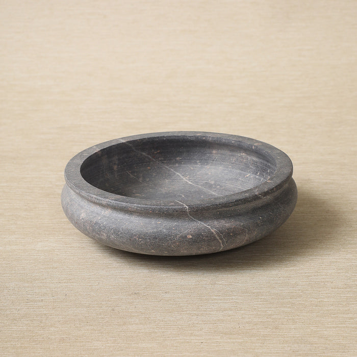 Low carved stone bowl