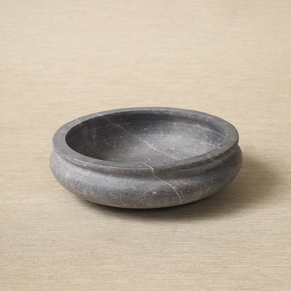 Low carved stone bowl