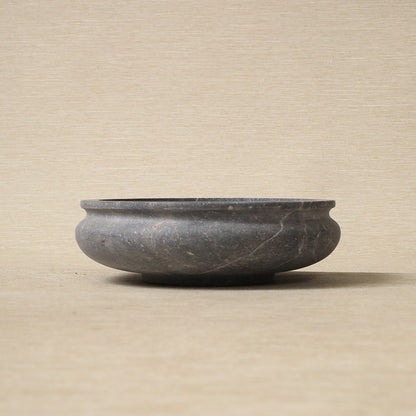 Low carved stone bowl