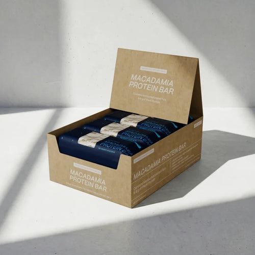 Box of Macadamia Protein Bars on a light gray background