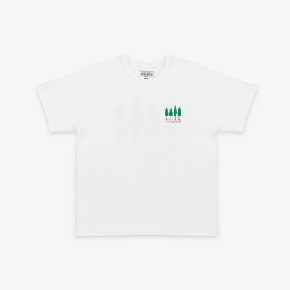 A white short-sleeve crewneck t-shirt with a small green graphic of four pine trees and the word 'PINEAPPLE' printed on the left chest, displayed on a clean white background.