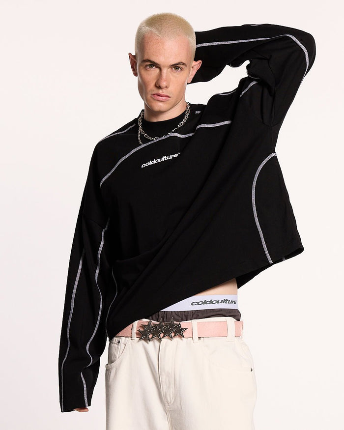 ROLLER LONGSLEEVE TEE BLACK - black oversized longsleeve tee, front view on male model - Cold Culture #man