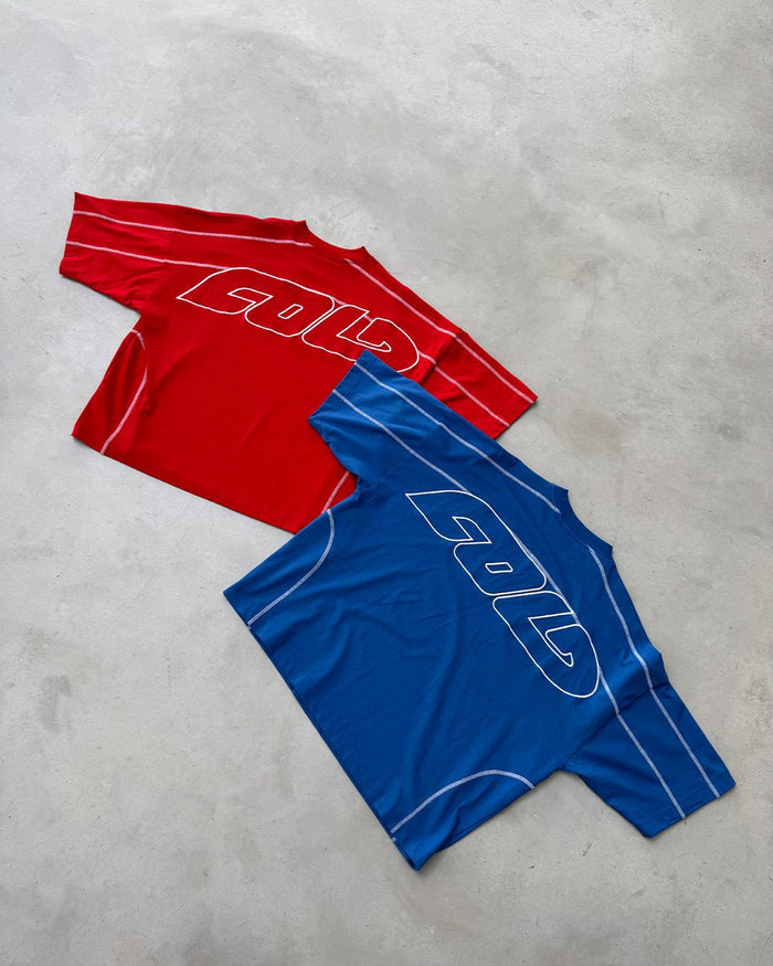 ROLLER TEE RED - red oversized tee, flat lay with matching pieces - Cold Culture